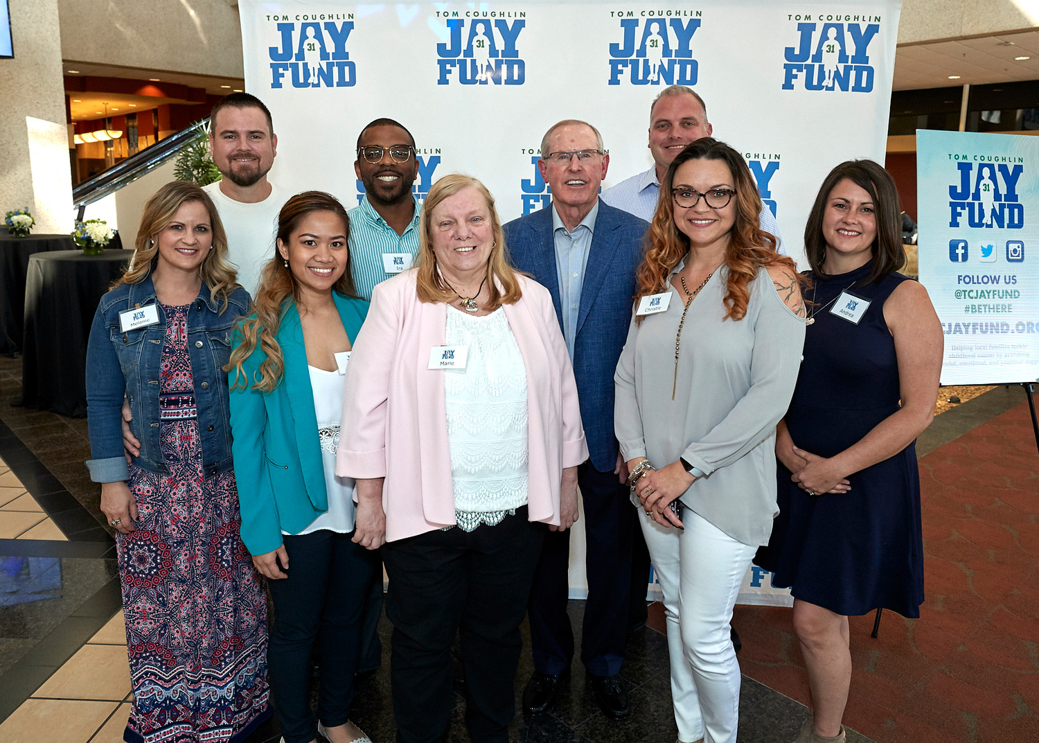 Tom Coughlin gathers with the evening’s VIP hosts, who are Jay Fund families whose child has tackled or is tackling cancer.